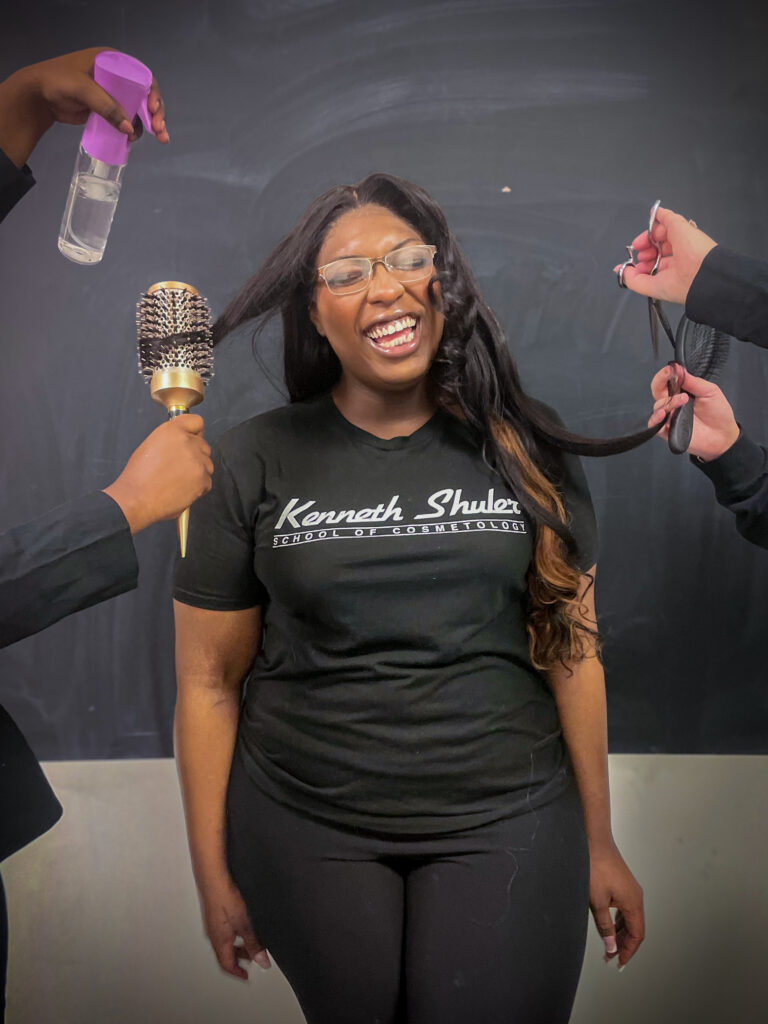 Student Showcasing Hairstyling Skills Student Showcasing Hairstyling Skills